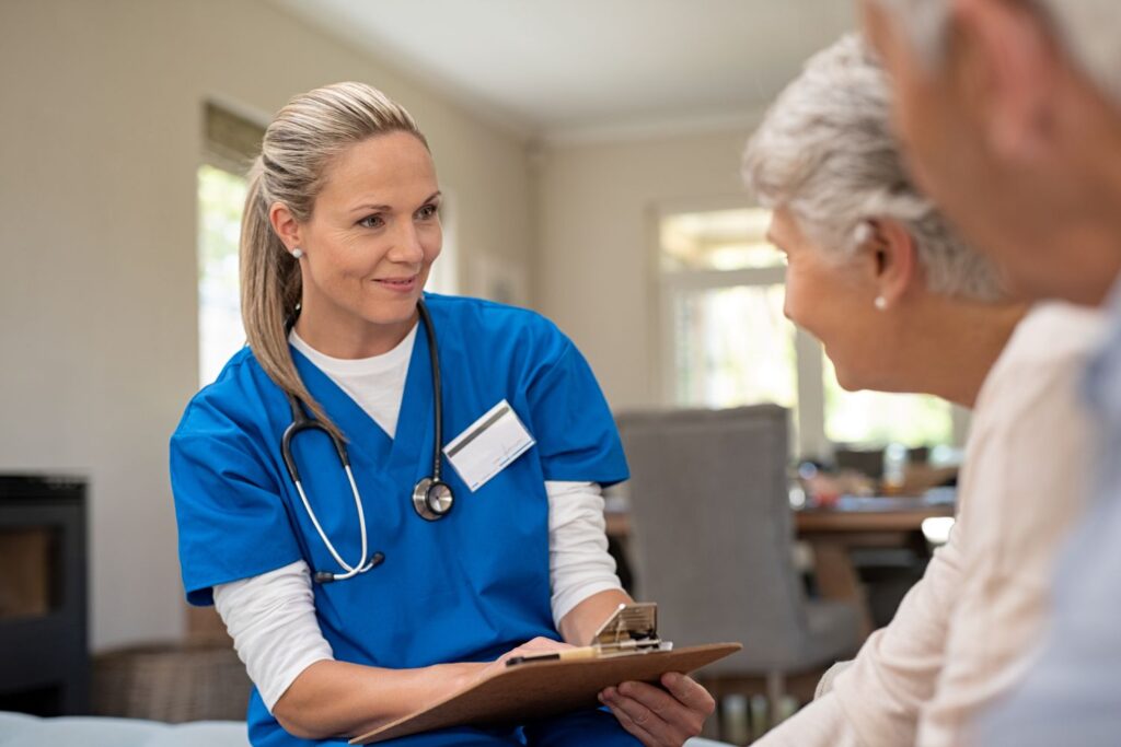 Nurse caring for elderly woman