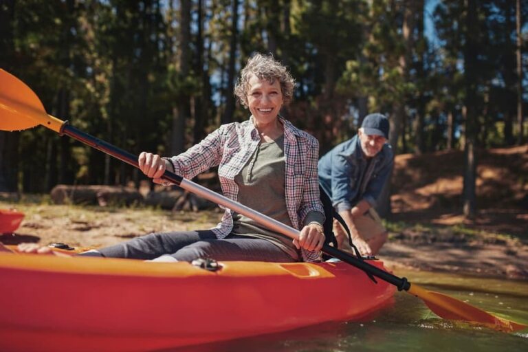 Older retired couple kayaking